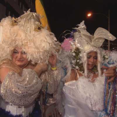 Two unknown people dressed up.