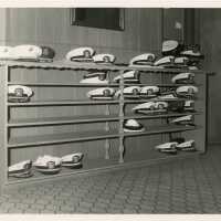 A shelf with military hats