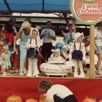 Unknown children dressed up on a stage.