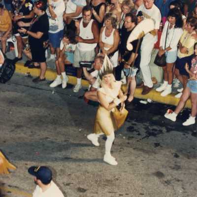Unknown lady walking in the parade.