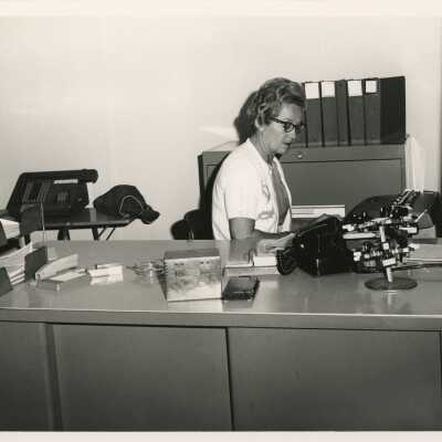 An unknown woman in an office