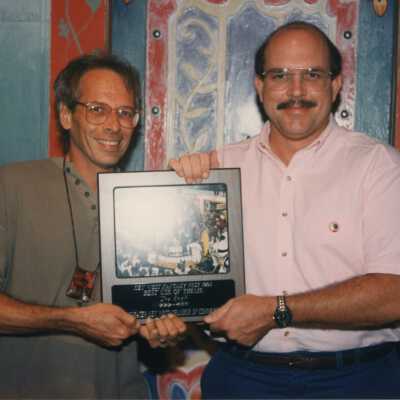 Unknown men with a plaque.