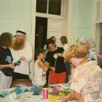 A group of unknown people working on face mask.