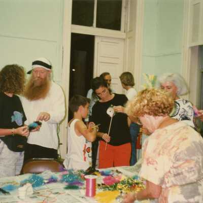 A group of unknown people working on face mask.