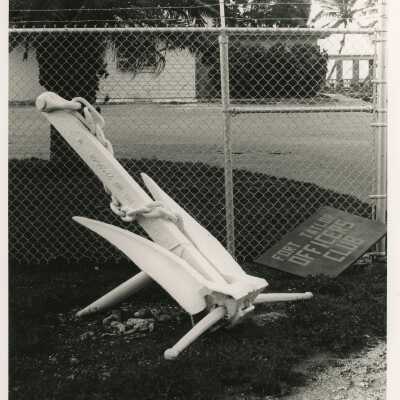 An Anchor sitting next to a sign that reads Fort Taylor Officers club