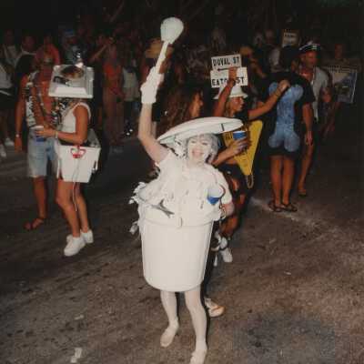 Unknown person dressed up walking in the street for the parade.