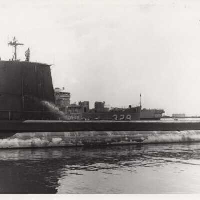 U.S.S. KRETCHMER and a submarine