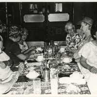A group of unknown woman sitting at a table