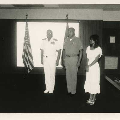 3 Unknown people at a ceremony