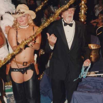 An Unknown woman and Capt. Tony on a float.