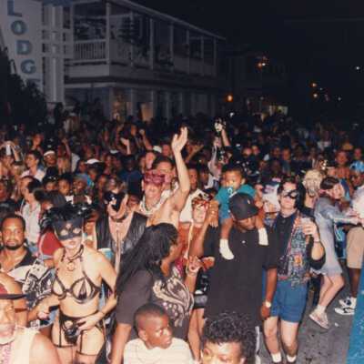 A group of unknown people on Duval street.