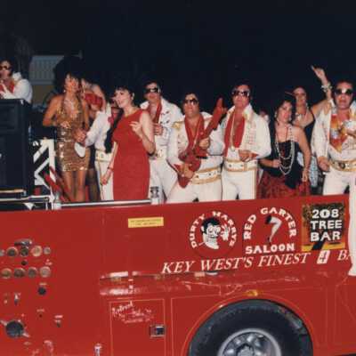 Unknown people dressed up on the Rick's complex float.