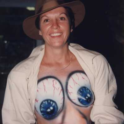 Unknown woman with her breast painted.