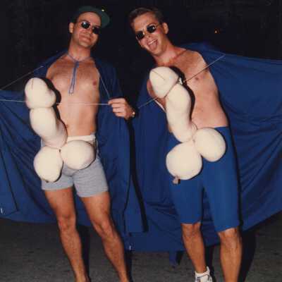 Two unknown men dressed up.