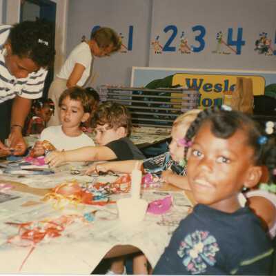 Unknown kids and teachers in a classroom.