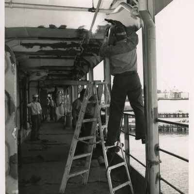 U.S. Navy men working on a ship