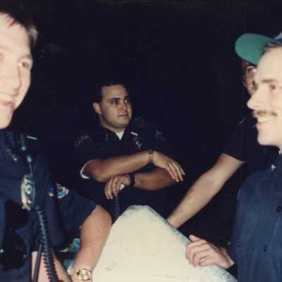 Three unknown cops.
