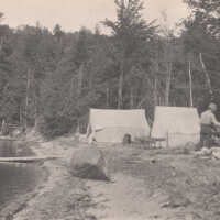          Man with tents and a canoe picture number 1
   