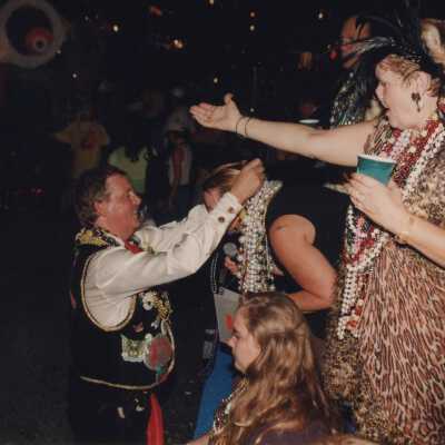 Unknown ladies on a float receiving beads.
