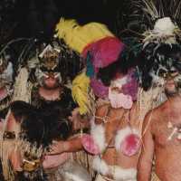 Four unknown people dressed up.