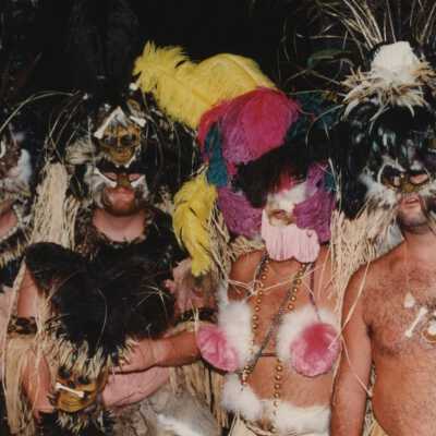 Four unknown people dressed up.