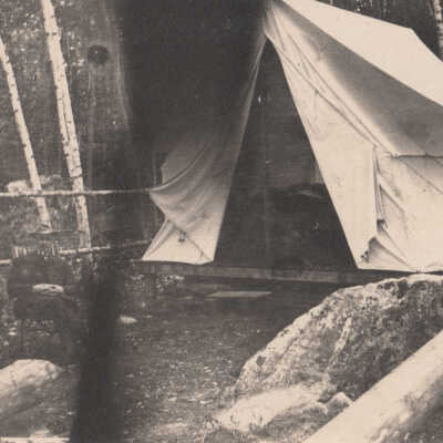 Man in front of tent