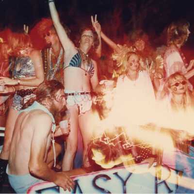 Unknown people dressed up on a float.