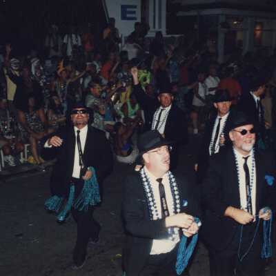 Unknown people dressed up on the street for the parade.