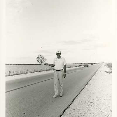 Unknown man holding up an election sign on US 1.