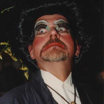 An unknown man dressed up.