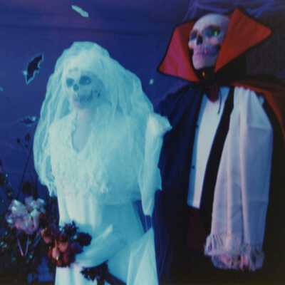 Two unknown people dressed up.