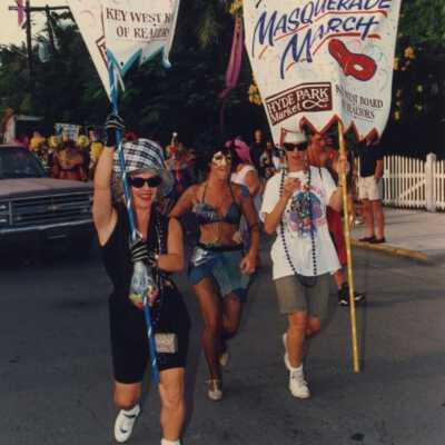 Unknown people holding signs for the masquerade march.