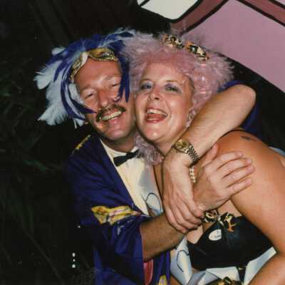 Two unknown people dressed up.