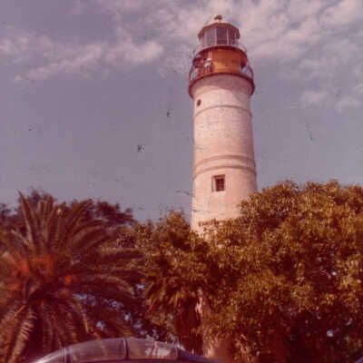 Key West Lighthouse and a Blue Angel plane