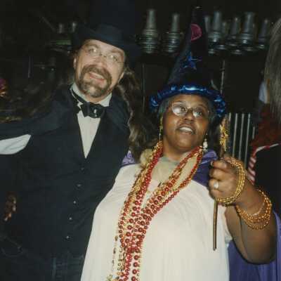 Two unknown people dressed up.