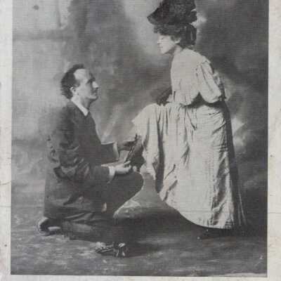 Man kneeling with a shoe