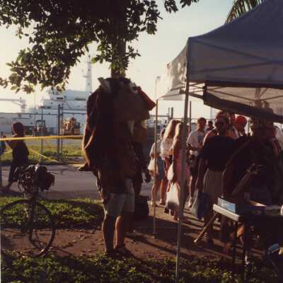 Unknown people waiting in a line.