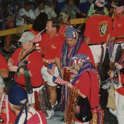 Unknown group of people walking in the street for the parade.