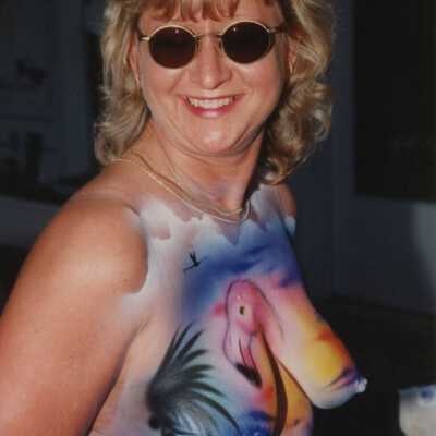 Unknown woman with her breast painted.