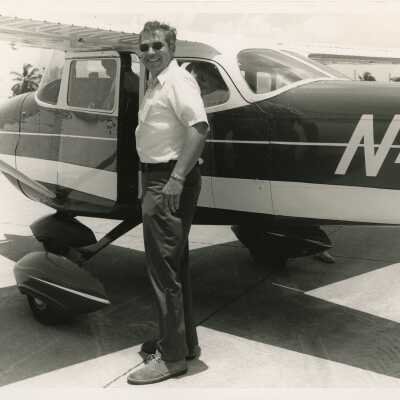 Unknown man standing outside of a plane