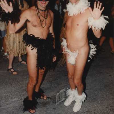 Two unknown men dressed up.