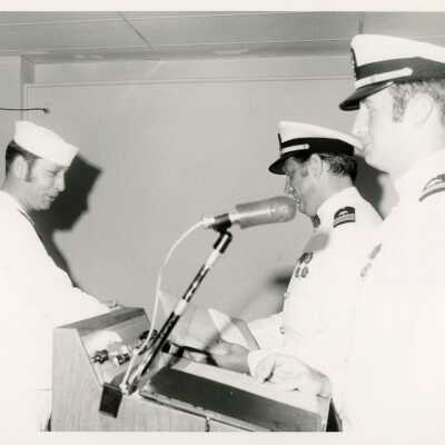 Men in uniform standing at the podium