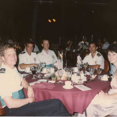 Unknown people sitting at a table at a party