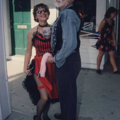 Two unknown people dressed up.