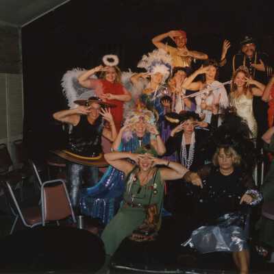 A group of unknown people dressed up.