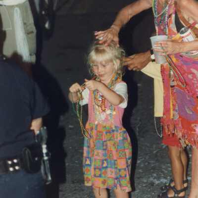 Unknown child playing with beads.