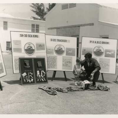 U.S. Military man at some type of fair with a child