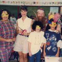 A group of unknown people at a school.