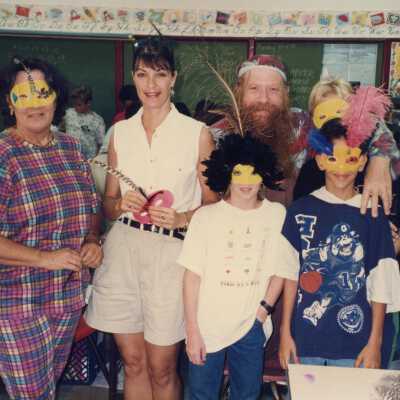 A group of unknown people at a school.