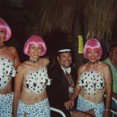 Four unknown people dressed up.